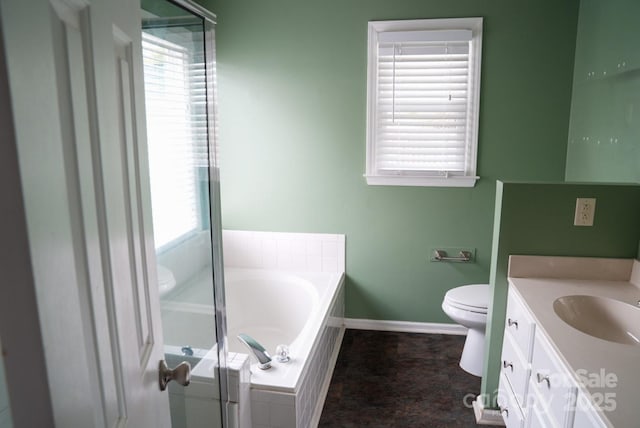 204 Foley Dr, Garner, NC 27529 - full bathroom featuring baseboards, a bath, plenty of natural light, and vanity