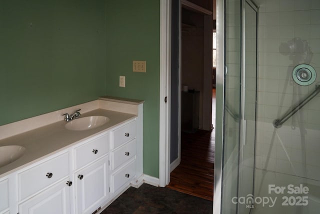 204 Foley Dr, Garner, NC 27529 - full bathroom with a tile shower, a sink, and double vanity