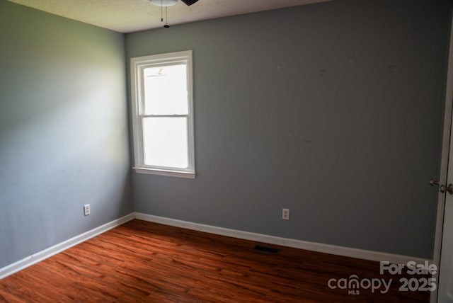 204 Foley Dr, Garner, NC 27529 - spare room with baseboards, a ceiling fan, wood finished floors, and visible vents