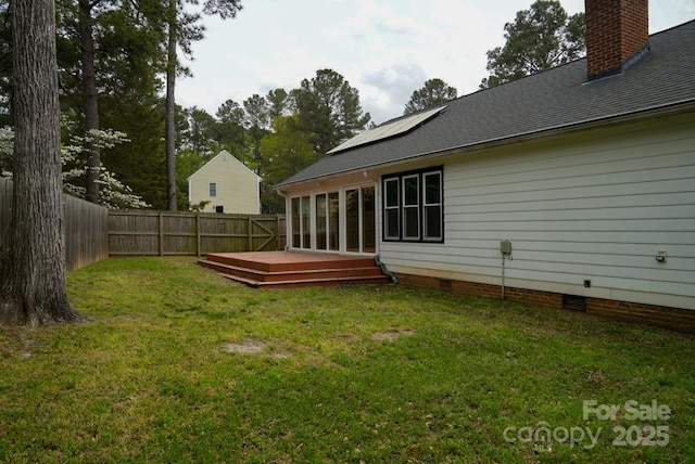 204 Foley Dr, Garner, NC 27529 - rear view of property featuring crawl space, a deck, a fenced backyard, a yard, and roof with shingles