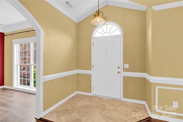 4155 Guilford Ct NW, Concord, NC 28027 - foyer entrance with crown molding, arched walkways, baseboards, and lofted ceiling