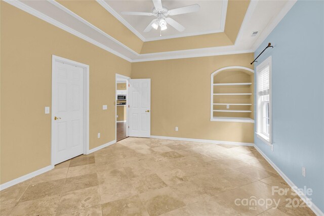 4155 Guilford Ct NW, Concord, NC 28027 - unfurnished bedroom with multiple windows, a tray ceiling, ornamental molding, and baseboards