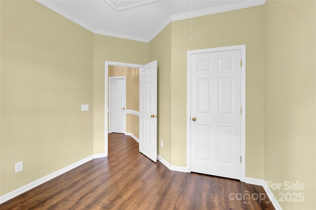 4155 Guilford Ct NW, Concord, NC 28027 - unfurnished bedroom featuring crown molding, dark wood-type flooring, baseboards, and attic access