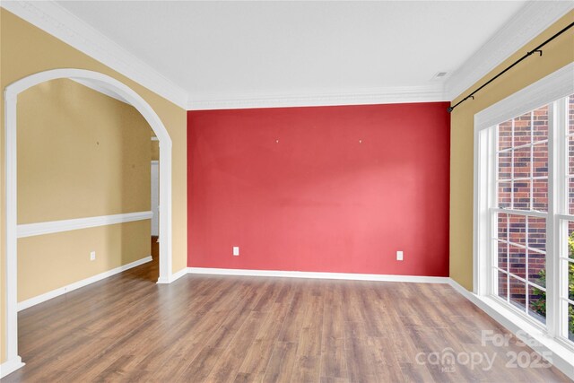 4155 Guilford Ct NW, Concord, NC 28027 - unfurnished room featuring healthy amount of natural light, crown molding, wood finished floors, and baseboards