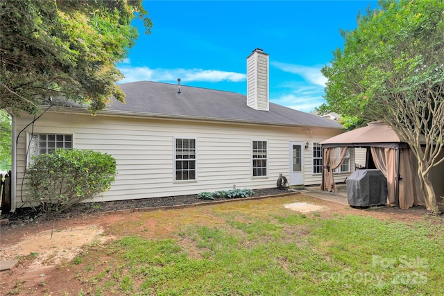 4155 Guilford Ct NW, Concord, NC 28027 - back of property with a gazebo, a chimney, a lawn, and a patio