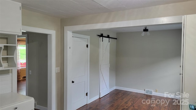 18 Misty Meadows Rd, Burnsville, NC 28714 - mudroom with a barn door and dark wood-style floors