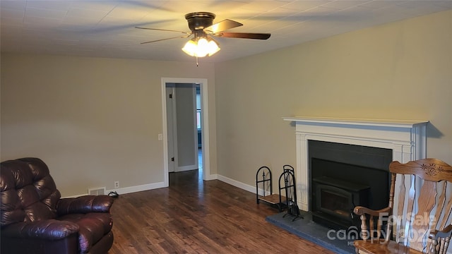18 Misty Meadows Rd, Burnsville, NC 28714 - living area featuring dark wood-type flooring, ceiling fan, and a fireplace