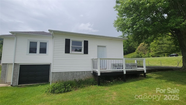 18 Misty Meadows Rd, Burnsville, NC 28714 - back of property featuring a lawn, a deck, and an attached garage
