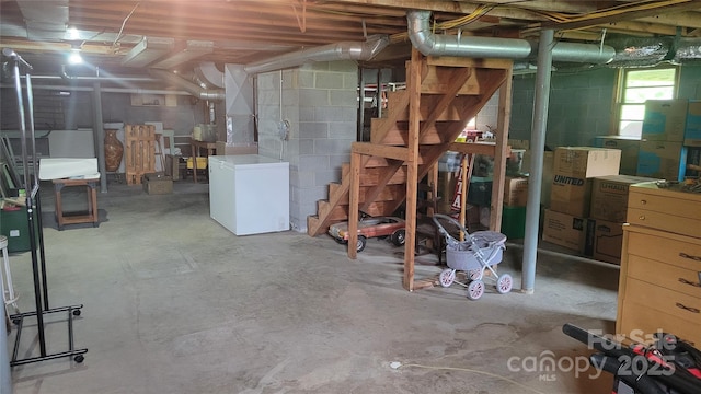 18 Misty Meadows Rd, Burnsville, NC 28714 - below grade area featuring refrigerator