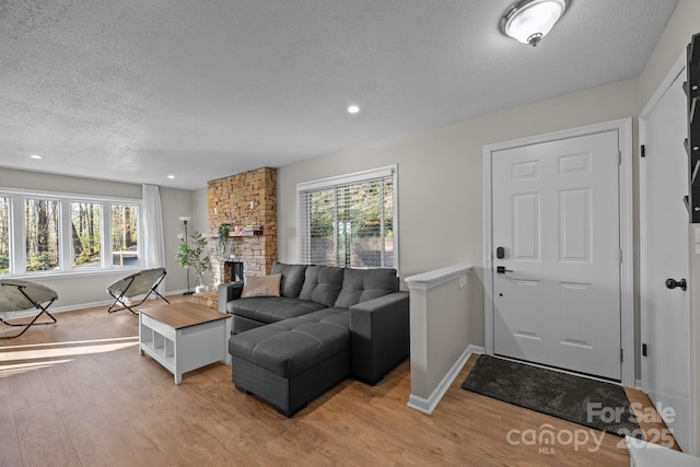 159 Long John Dr, Hendersonville, NC 28791 - living room featuring a wealth of natural light, light wood-style flooring, and a textured ceiling