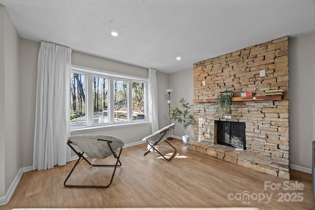 159 Long John Dr, Hendersonville, NC 28791 - sitting room featuring a fireplace, baseboards, and wood finished floors