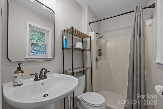 159 Long John Dr, Hendersonville, NC 28791 - bathroom featuring a shower stall, a sink, and toilet