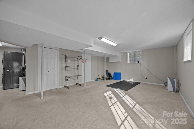 159 Long John Dr, Hendersonville, NC 28791 - below grade area featuring baseboards, plenty of natural light, and light colored carpet