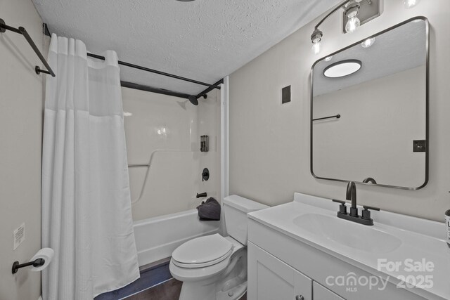 159 Long John Dr, Hendersonville, NC 28791 - full bathroom with toilet, shower / tub combo with curtain, vanity, and a textured ceiling