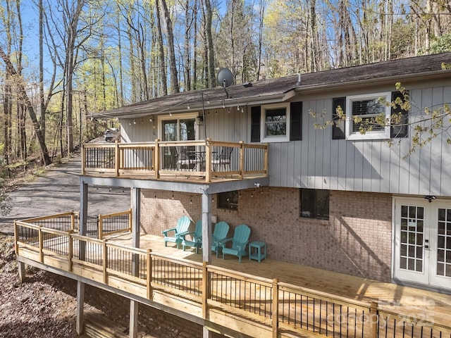 159 Long John Dr, Hendersonville, NC 28791 - rear view of house featuring french doors, a deck, and brick siding