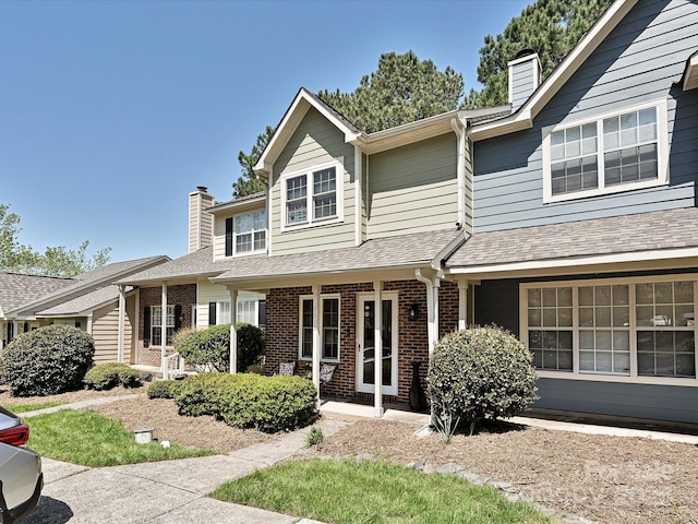 9305 Four Mile Creek Rd, Charlotte, NC 28277 - traditional-style home with a chimney, a shingled roof, and brick siding