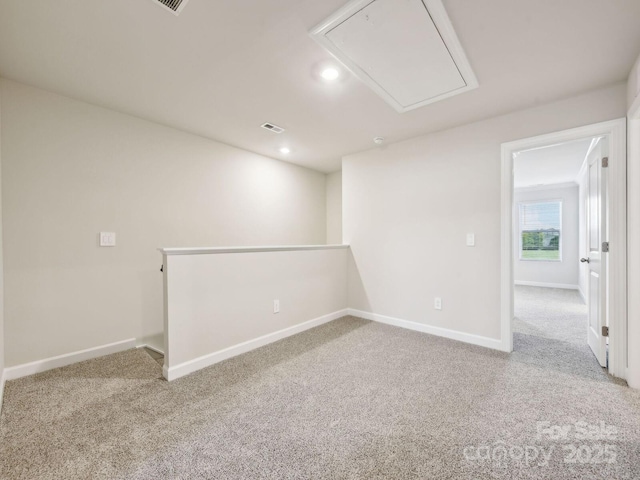 below grade area featuring carpet floors, baseboards, and recessed lighting