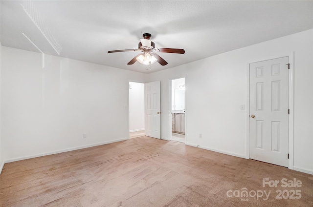 empty room featuring light carpet, baseboards, and a ceiling fan