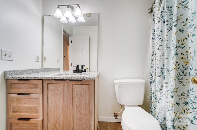 bathroom featuring toilet, vanity, a shower with shower curtain, and baseboards