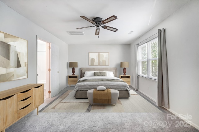carpeted bedroom featuring visible vents, baseboards, connected bathroom, and ceiling fan