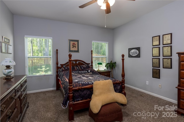 bedroom with baseboards, multiple windows, and carpet