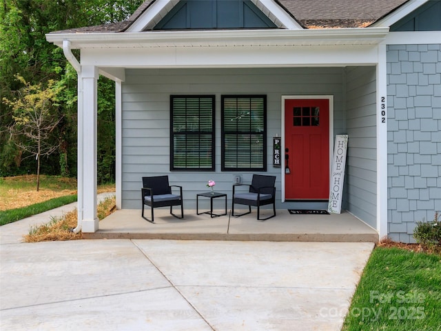 doorway to property featuring a porch