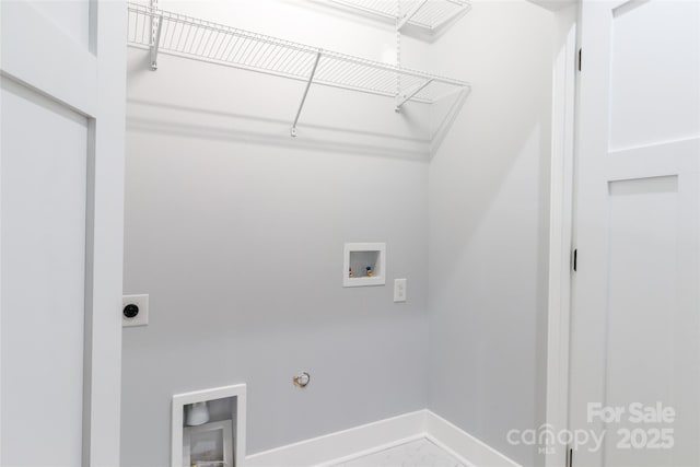 clothes washing area featuring gas dryer hookup, washer hookup, laundry area, electric dryer hookup, and baseboards
