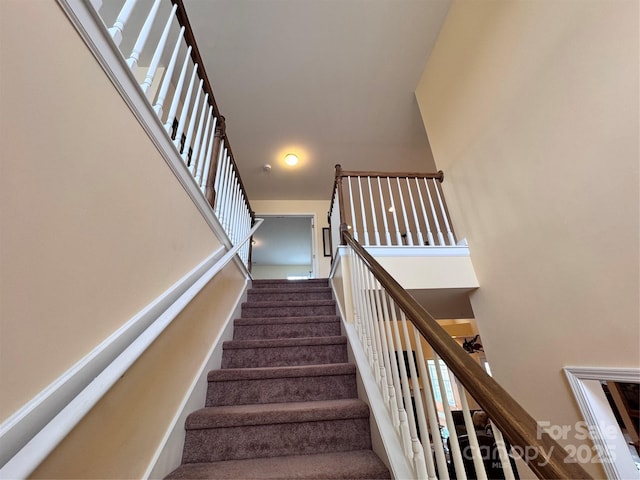 stairway with a high ceiling