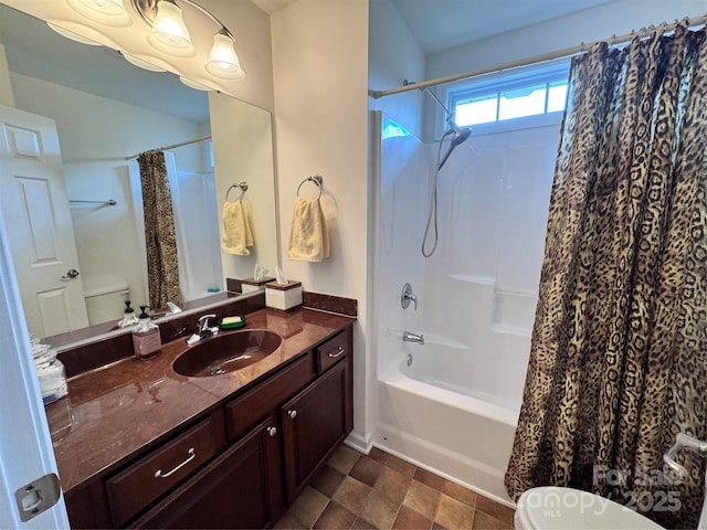 full bathroom featuring shower / tub combo, toilet, and vanity