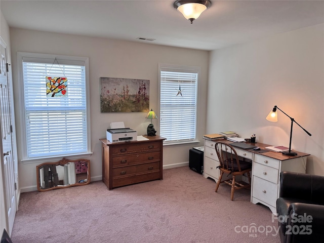 home office with carpet floors, visible vents, and baseboards