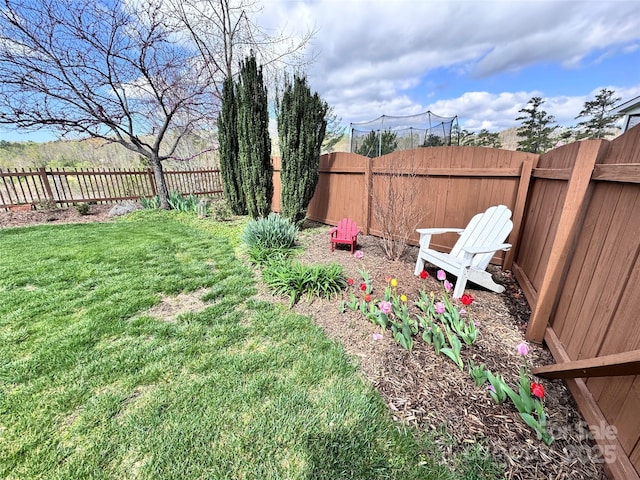 view of yard with a fenced backyard