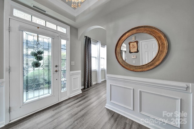 314 Wave Crest Dr, Tega Cay, SC 29708 - foyer entrance with wood finished floors, visible vents, crown molding, wainscoting, and a chandelier
