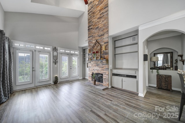 314 Wave Crest Dr, Tega Cay, SC 29708 - unfurnished living room with wood finished floors, french doors, a towering ceiling, and built in shelves