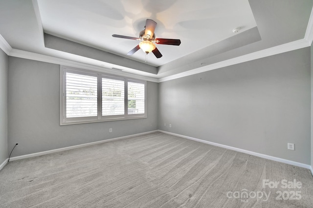 314 Wave Crest Dr, Tega Cay, SC 29708 - spare room with a raised ceiling, a ceiling fan, ornamental molding, light carpet, and baseboards