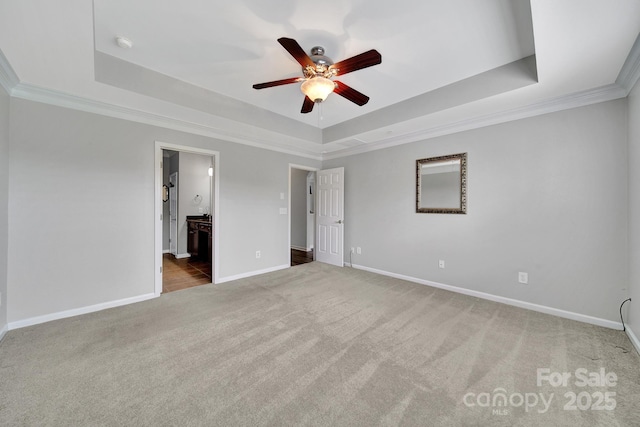 314 Wave Crest Dr, Tega Cay, SC 29708 - unfurnished bedroom featuring ornamental molding, baseboards, carpet floors, and a raised ceiling