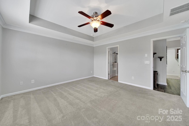 314 Wave Crest Dr, Tega Cay, SC 29708 - unfurnished bedroom with carpet flooring, a tray ceiling, baseboards, visible vents, and crown molding