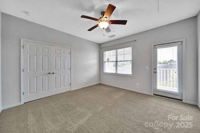 314 Wave Crest Dr, Tega Cay, SC 29708 - unfurnished bedroom featuring visible vents, a ceiling fan, access to exterior, baseboards, and carpet flooring