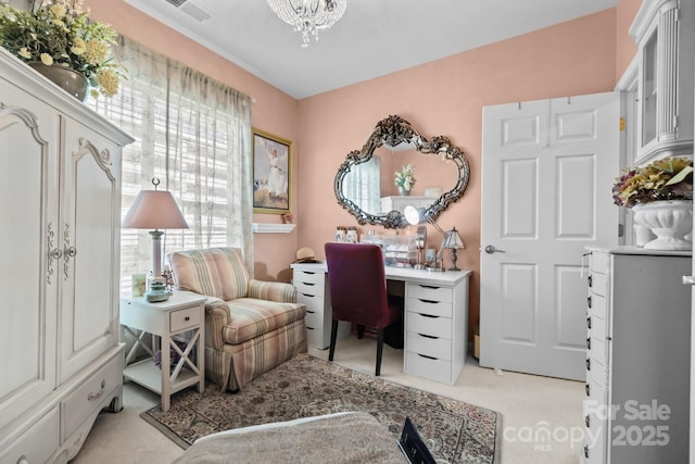 office with visible vents, an inviting chandelier, and light colored carpet