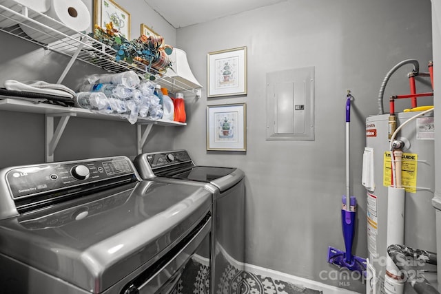 washroom with independent washer and dryer, laundry area, electric panel, and water heater