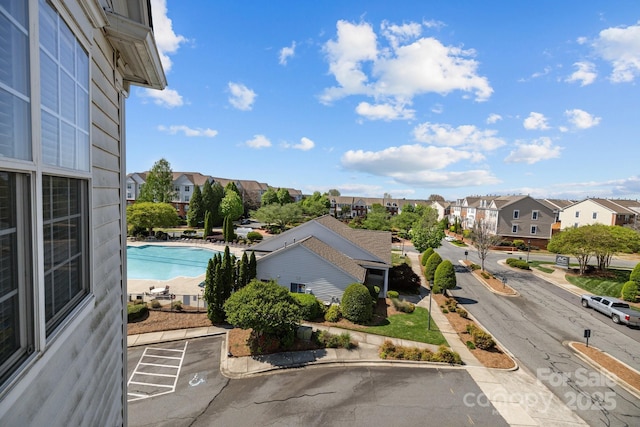 outdoor pool with a residential view