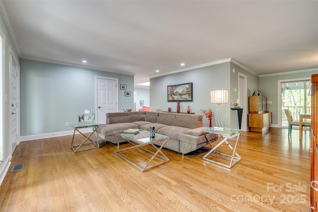 living room featuring ornamental molding, visible vents, recessed lighting, and wood finished floors