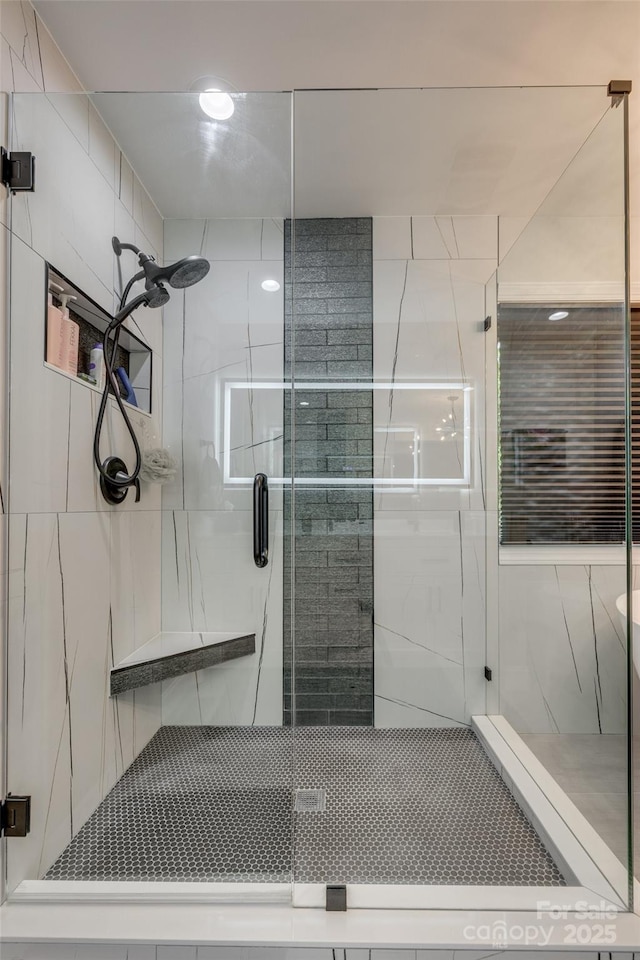 bathroom with a shower stall
