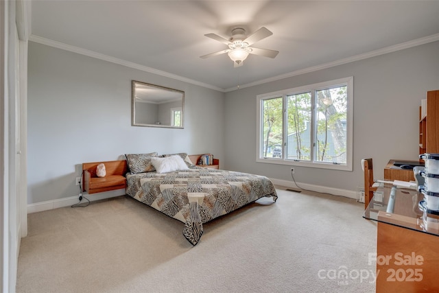 bedroom with ornamental molding, baseboards, and light carpet