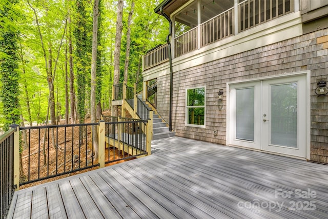 wooden deck featuring french doors and stairs