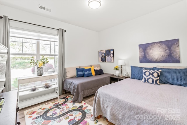 bedroom with wood finished floors