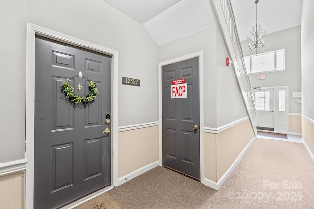 12357 Copper Mountain Blvd, Charlotte, NC 28277 - carpeted entryway featuring a chandelier and vaulted ceiling