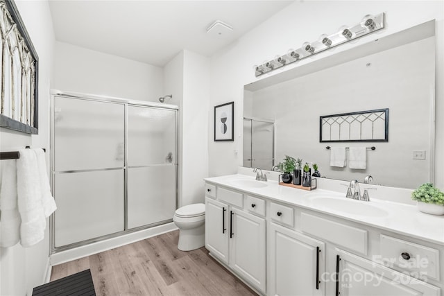 12357 Copper Mountain Blvd, Charlotte, NC 28277 - bathroom with double vanity, wood finished floors, and a shower stall