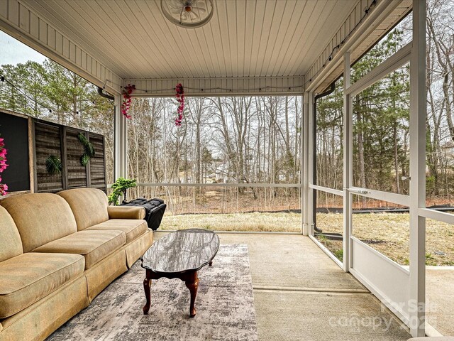 sunroom / solarium with an outdoor hangout area and plenty of natural light