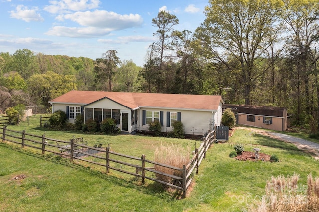 335 Ridgewood Dr, Mount Ulla, NC 28125 - ranch-style house with central AC, a sunroom, a front yard, fence, and a wooded view