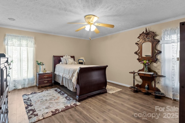 335 Ridgewood Dr, Mount Ulla, NC 28125 - bedroom with a textured ceiling, wood finished floors, baseboards, and ornamental molding